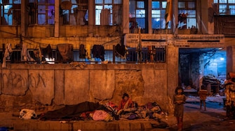 Homeless people sleep on streets as temperature dips in Delhi