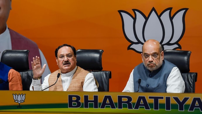 Union Home Minister Amit Shah and BJP National President JP Nadda address a joint press conference, in New Delhi, Saturday, March 5, 2022.